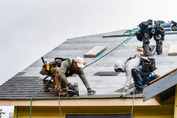 Professional Gutter Installation technician working in Dracut, MA